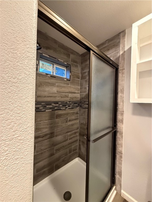 917 Corazan Street Alice, TX 78332 - Photo 34 of 37 a bathroom with a glass door