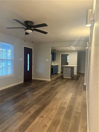 a bathroom with a light fixture a sink and a mirror