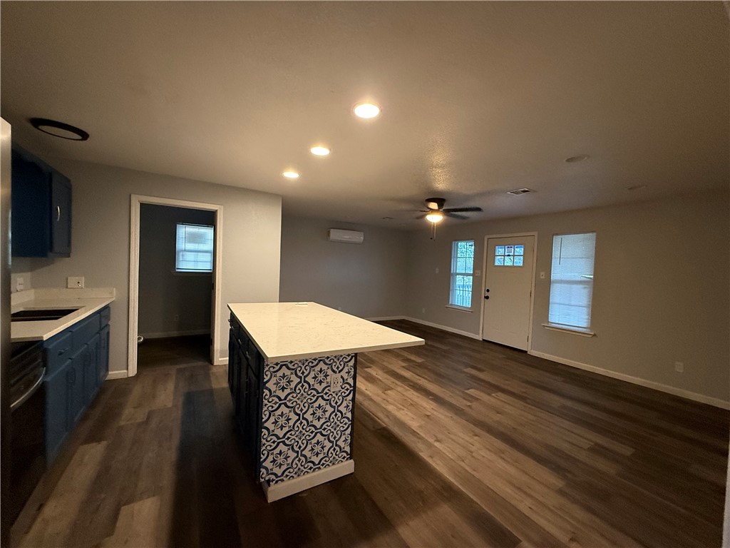 917 Corazan Street Alice, TX 78332 - Photo 8 of 37 a kitchen with a stove a sink and a refrigerator