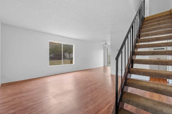 a view of an entryway with wooden floor and door