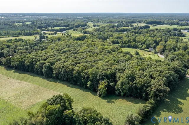 an aerial view of a houses with a lake view