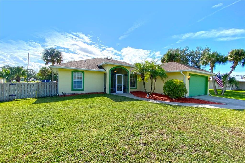 522 Cavern Terrace Sebastian, FL 32958 - Photo 2 of 29 a view of a house with a yard and tree s