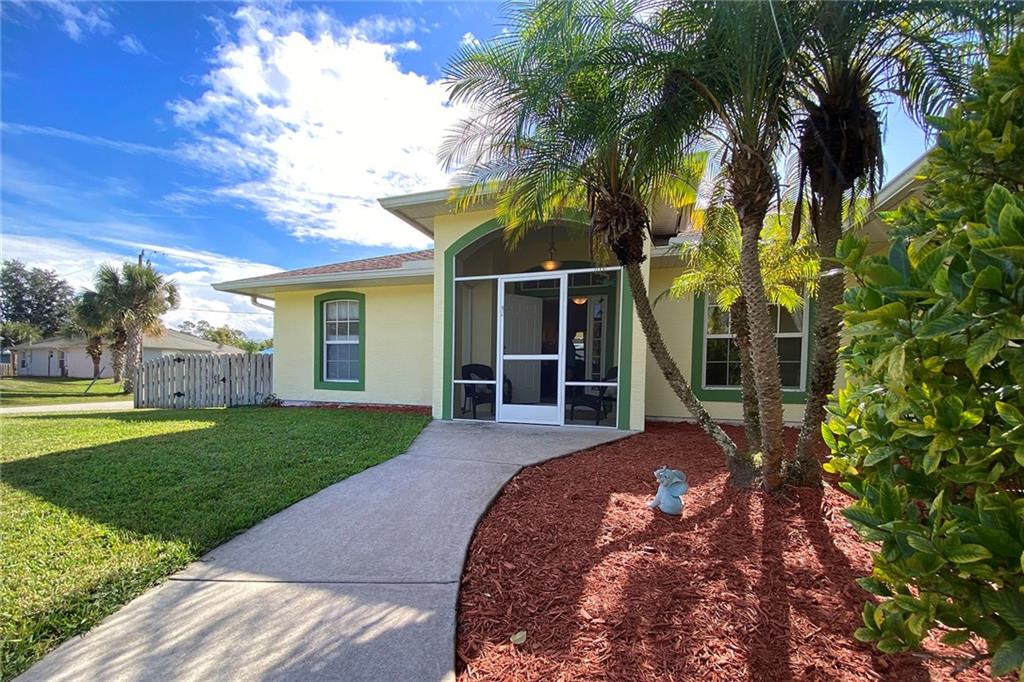 522 Cavern Terrace Sebastian, FL 32958 - Photo 3 of 29 a front view of a house with garden