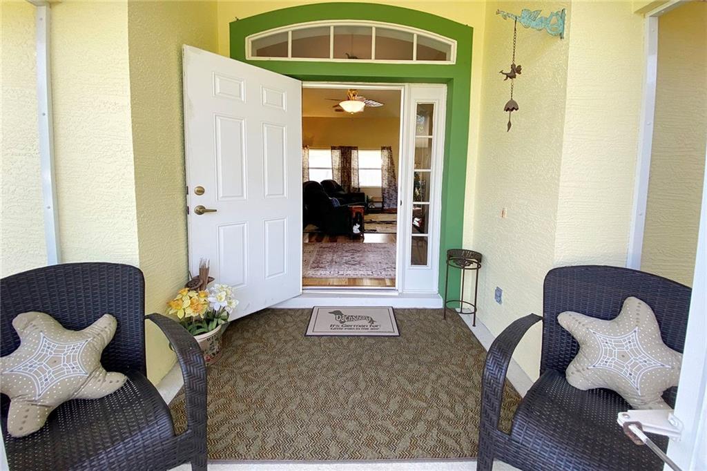 522 Cavern Terrace Sebastian, FL 32958 - Photo 5 of 29 a living room with furniture and a gate