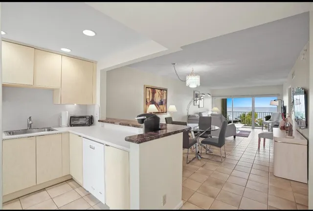 a view of a kitchen area with furniture and window