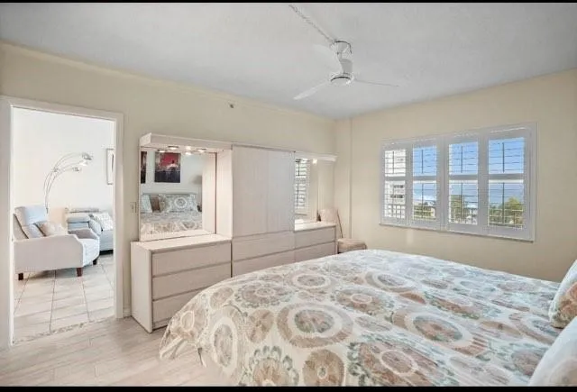a bedroom with a large bed and a window
