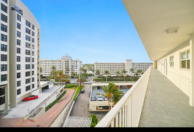a view of balcony with furniture