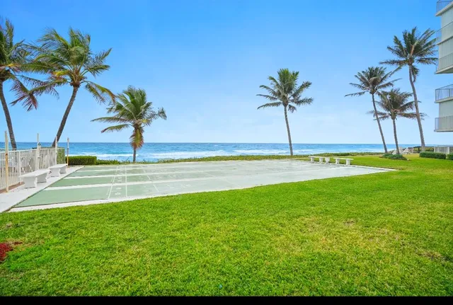 a view of a swimming pool and a yard