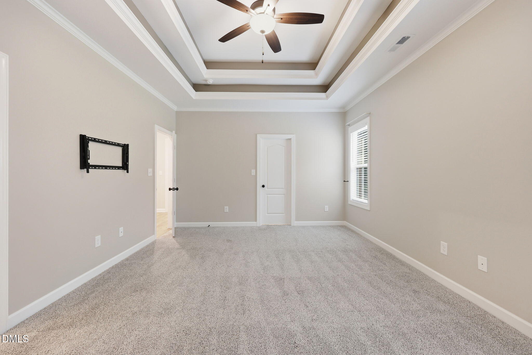 146 Seahawk Way Zebulon, NC 27597 - Photo 23 of 51 an empty room with windows and ceiling fan