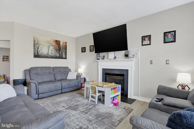 a bathroom with a sink vanity and a window