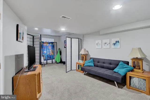 a view of a play room with furniture and toys