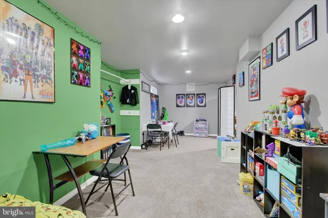 a view of a livingroom with toys and a flat screen tv