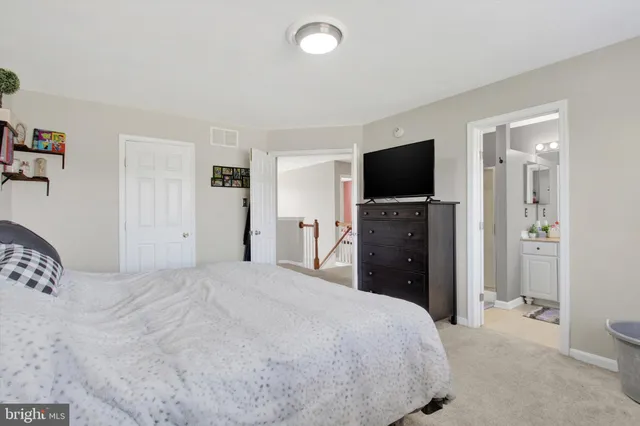 a bathroom with a bathtub a sink and a window
