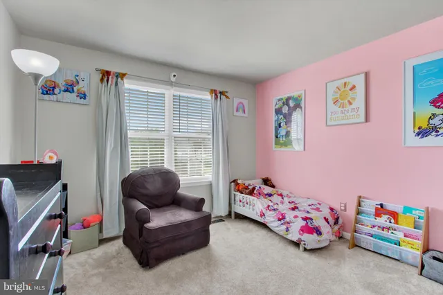 a bathroom with a sink a toilet and shower curtain