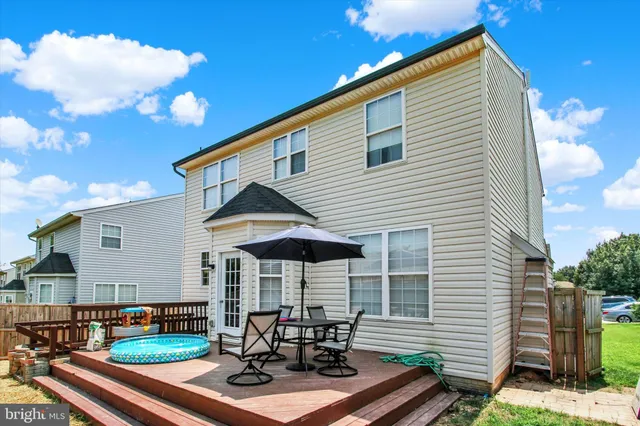 an aerial view of residential houses with outdoor space and street view
