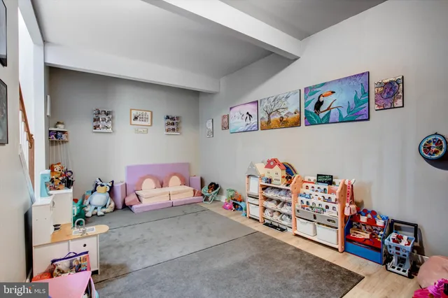 a living room with furniture and flat screen tv