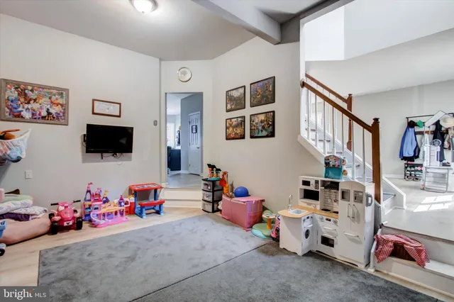 a view of a livingroom with furniture and a window