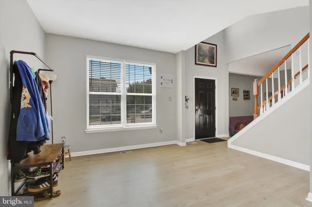a view of a livingroom with furniture and hardwood floor