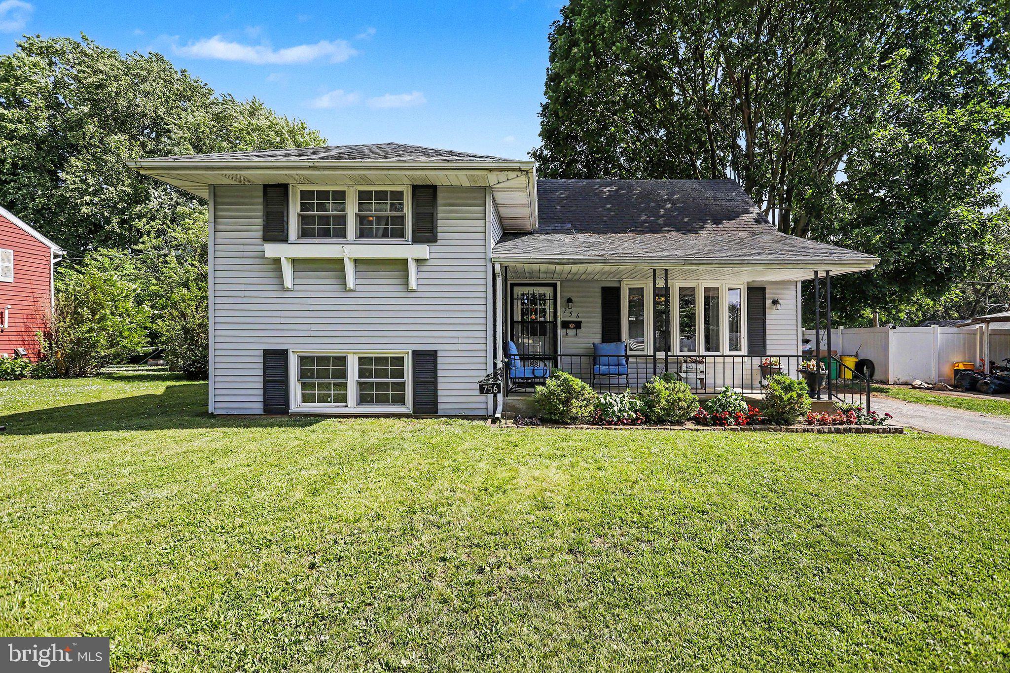 756 Fireside Road York, PA 17404 - Photo 2 of 29 Charming home with lush green lawn.