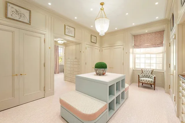 a spacious bathroom with a double vanity sink a mirror and a shower