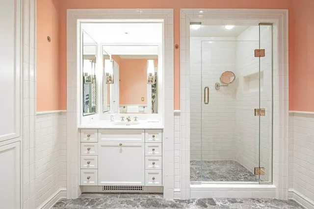 a spacious bathroom with a sink a mirror and a shower