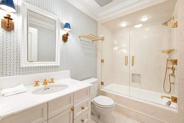 a bathroom with a shower sink and mirror