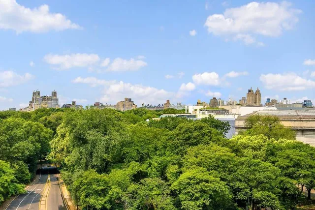 a bathroom with a bathtub shower sink vanity and toilet