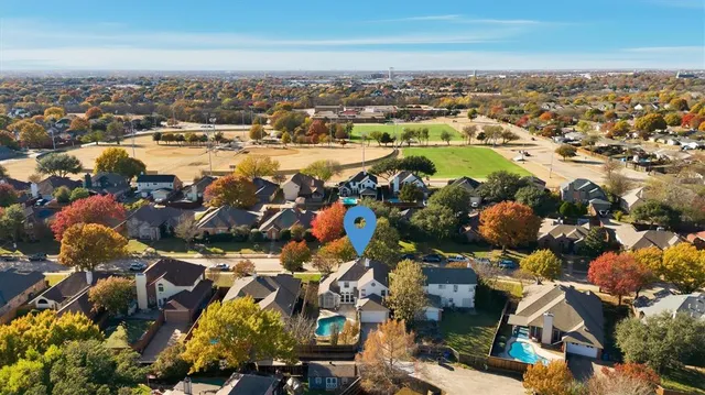 an aerial view of residential building and lake