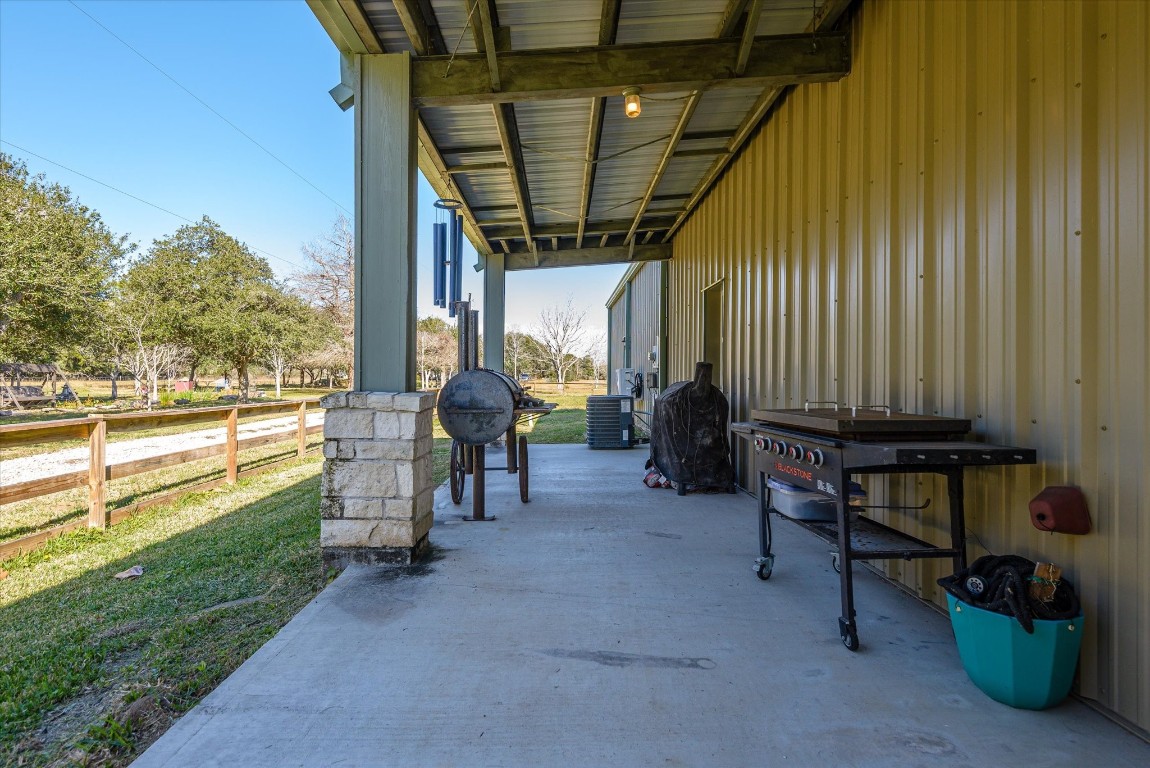 11578 28th Street Santa Fe, TX 77510 - Photo 11 of 46 a view of a porch with furniture and a yard
