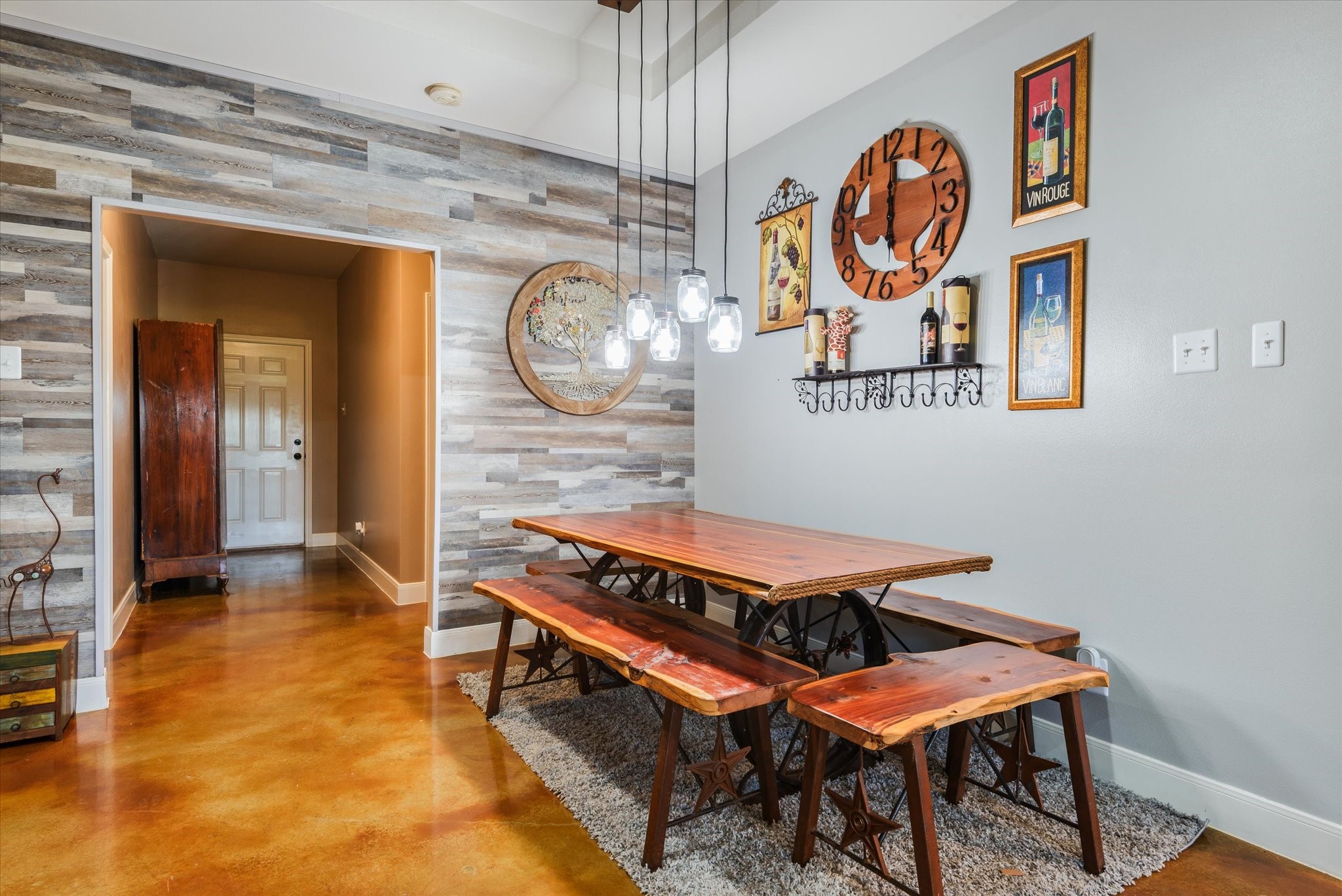 11578 28th Street Santa Fe, TX 77510 - Photo 17 of 46 a room with a table and paintings on the wall