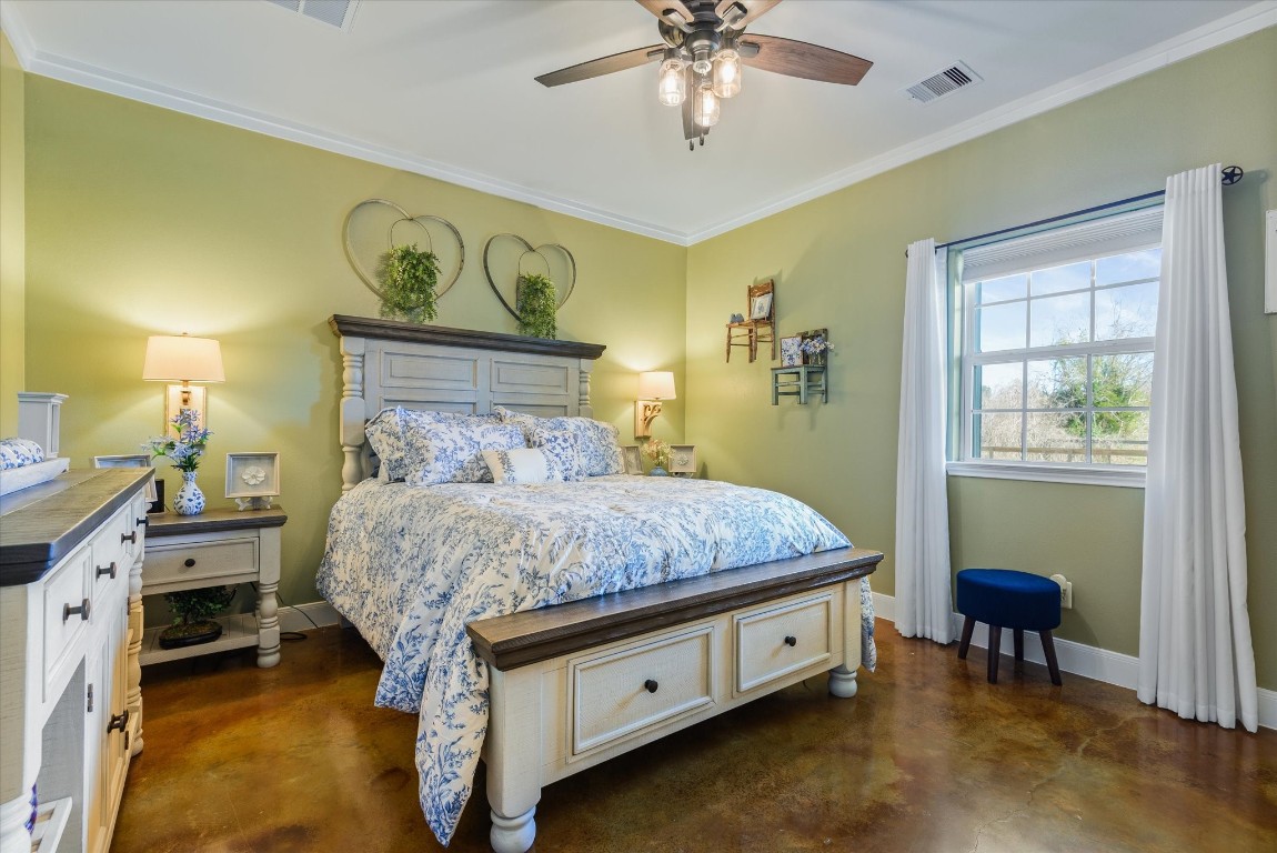 11578 28th Street Santa Fe, TX 77510 - Photo 20 of 46 a spacious bedroom with a bed and a table in it