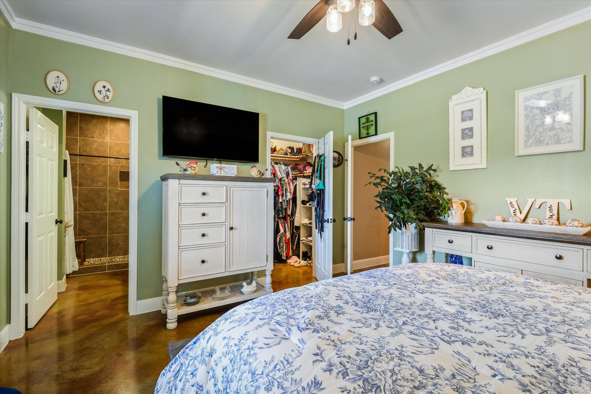 11578 28th Street Santa Fe, TX 77510 - Photo 21 of 46 a bedroom with a bed and a flat screen tv