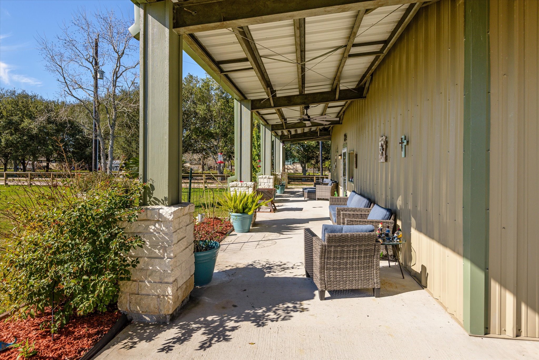 11578 28th Street Santa Fe, TX 77510 - Photo 8 of 46 a view of a porch with furniture and garden