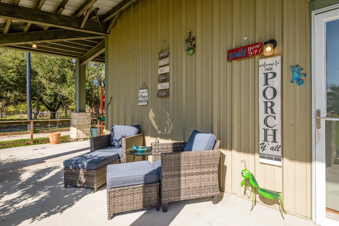 11578 28th Street Santa Fe, TX 77510 - Photo 9 of 46 a building outdoor space with patio furniture and potted plants