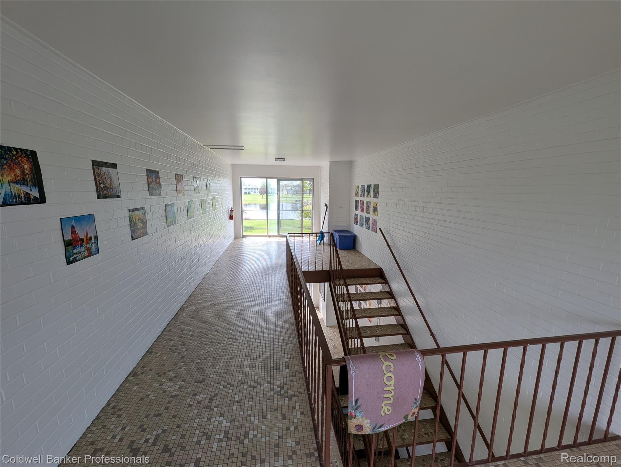 26945 Milford Road, Unit 8 New Hudson, MI 48165 - Photo 21 of 31 Hall with brick wall