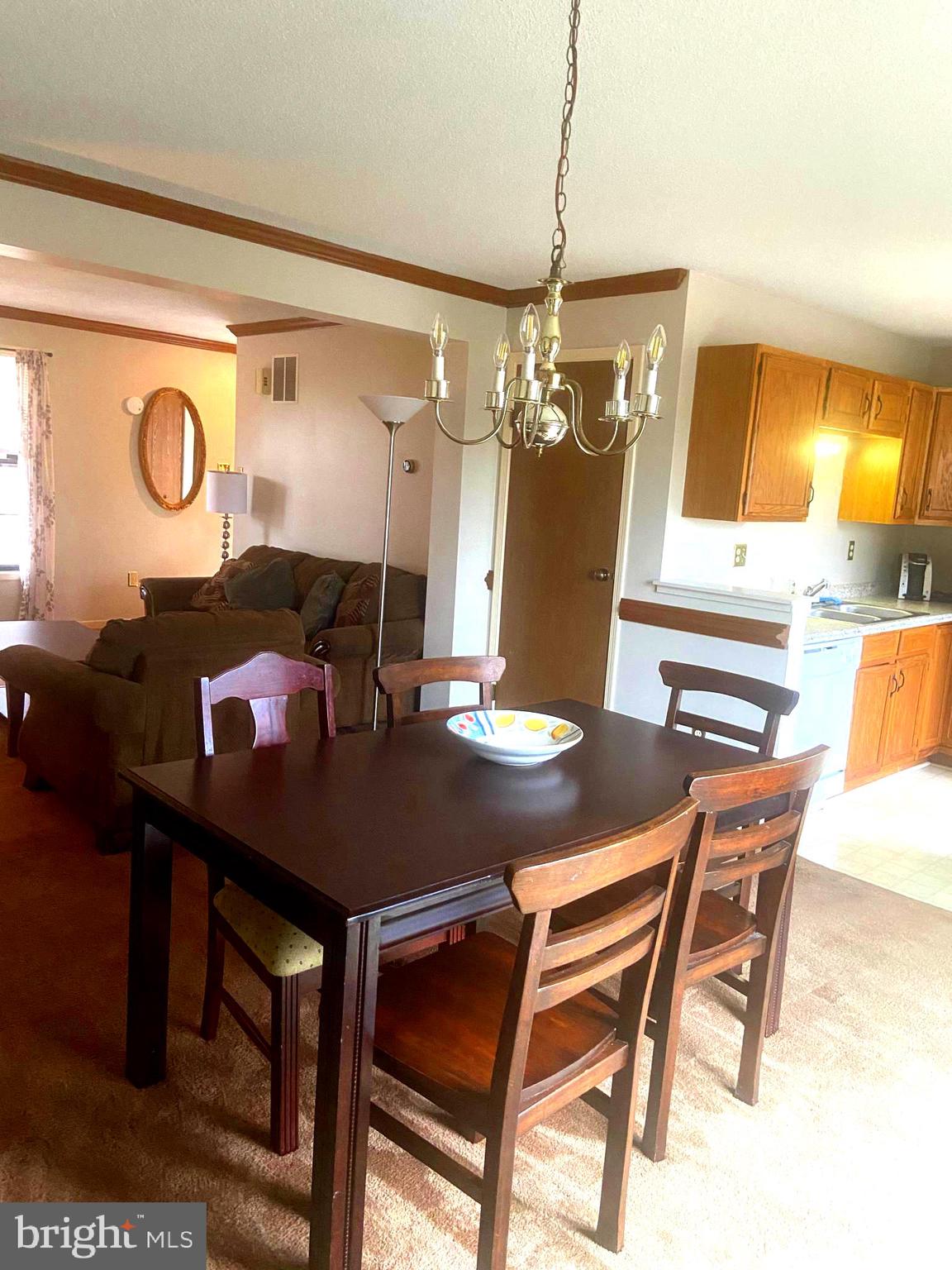 529 King Street Basye, VA 22810 - Photo 13 of 32 a view of a dining room with furniture and chandelier