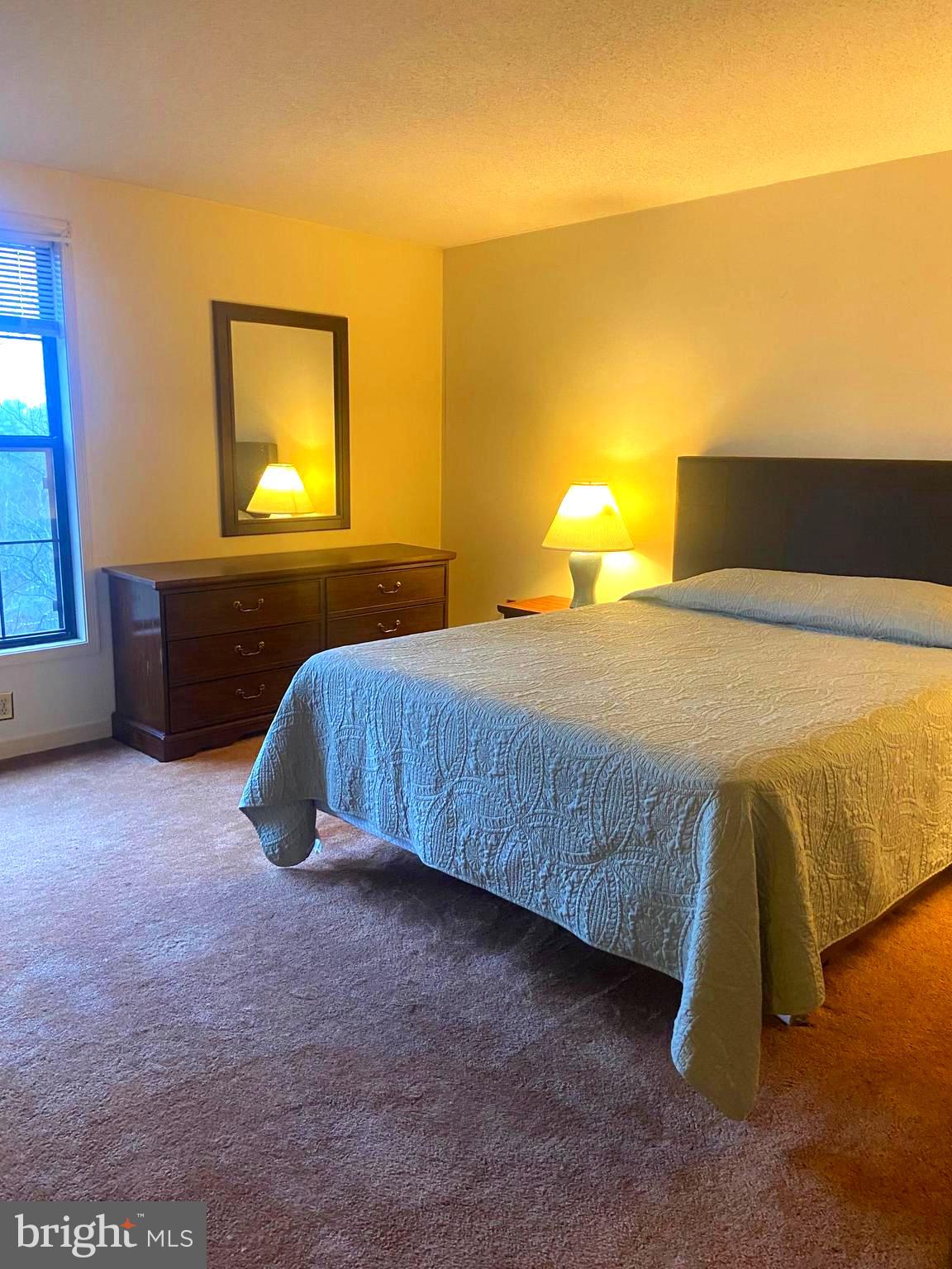 529 King Street Basye, VA 22810 - Photo 24 of 32 a bedroom with a bed and lamps