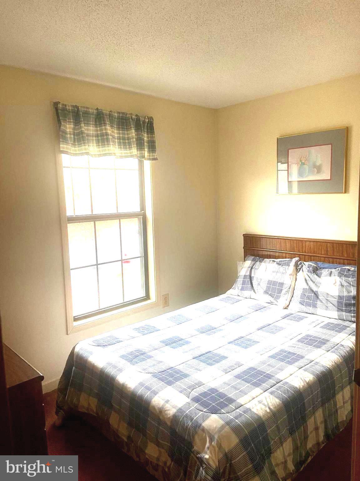 529 King Street Basye, VA 22810 - Photo 28 of 32 a bedroom with a bed and a window
