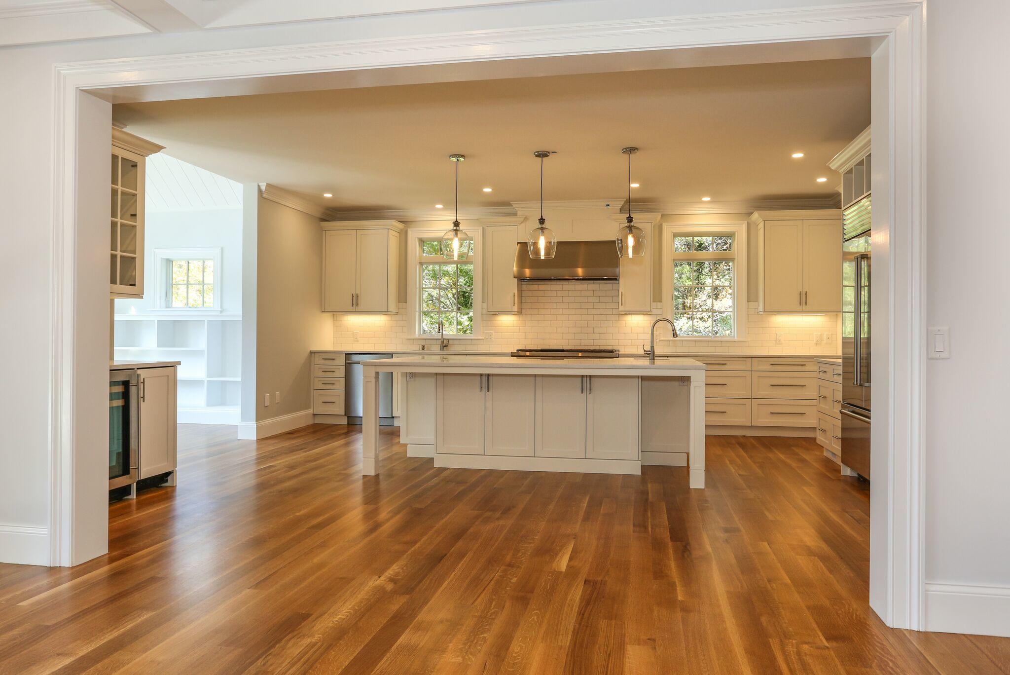 9 Jericho Road Dennis, MA 02638 - Photo 11 of 42 a kitchen with kitchen island a counter top space a sink stainless steel appliances and cabinets