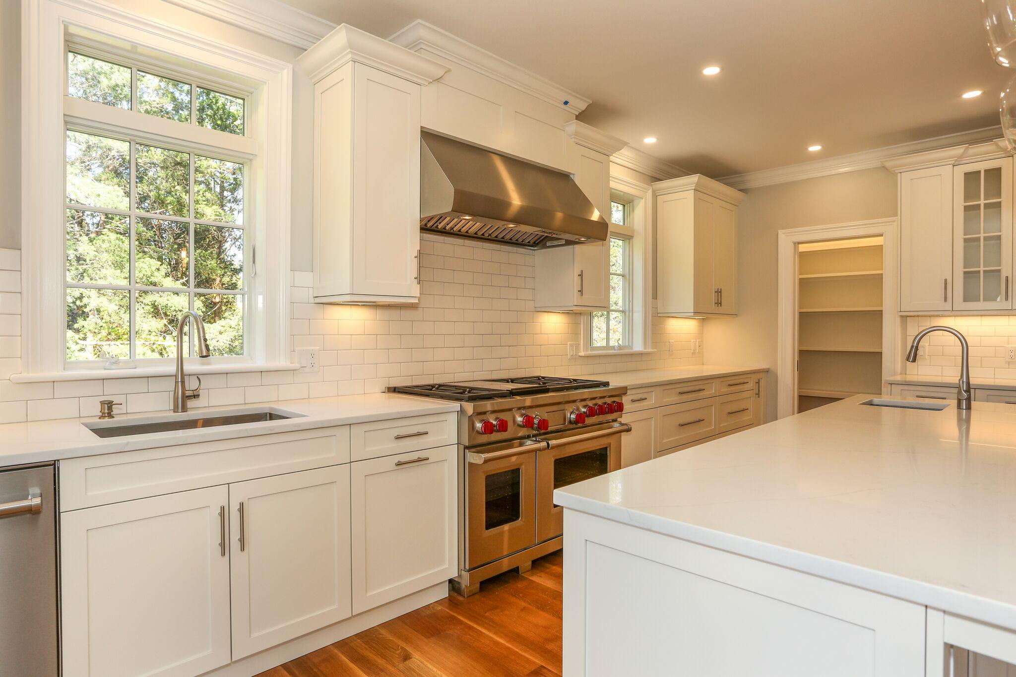 9 Jericho Road Dennis, MA 02638 - Photo 15 of 42 a kitchen with a stove a sink and a microwave