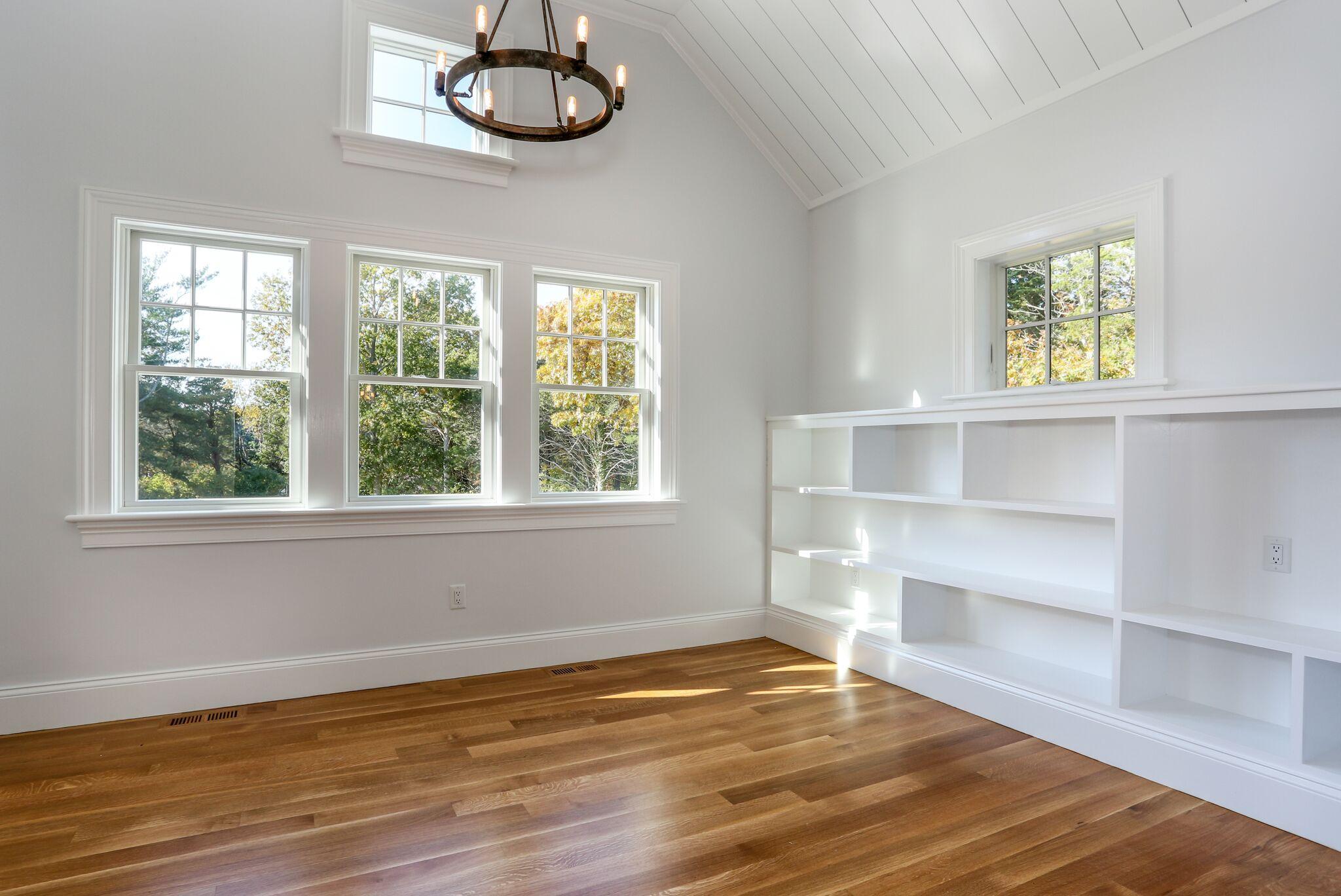 9 Jericho Road Dennis, MA 02638 - Photo 16 of 42 a view of an empty room with a window and wooden floor