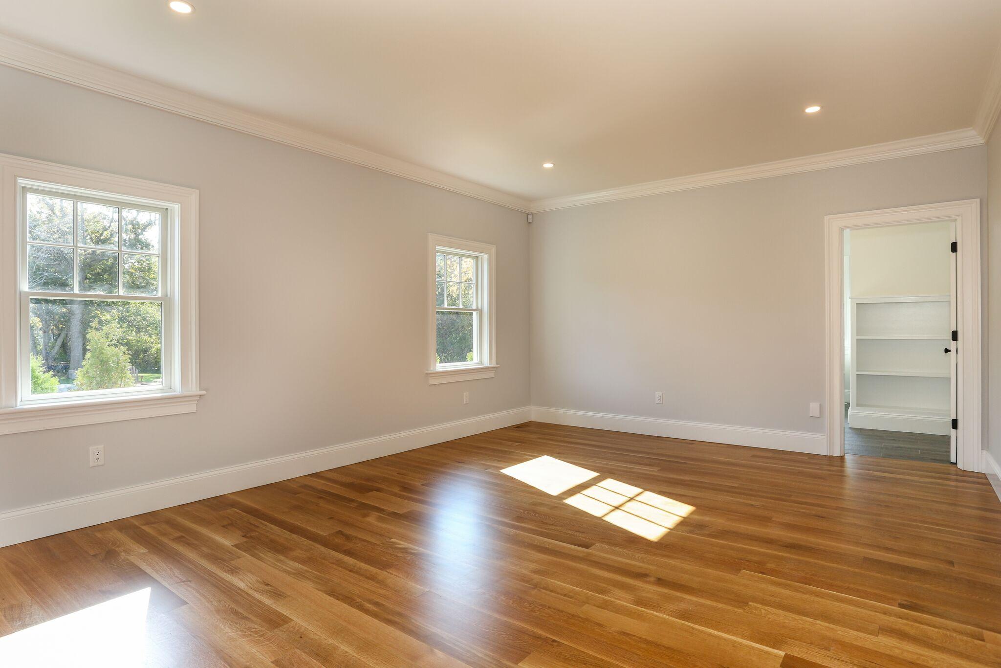 9 Jericho Road Dennis, MA 02638 - Photo 18 of 42 an empty room with wooden floor and windows