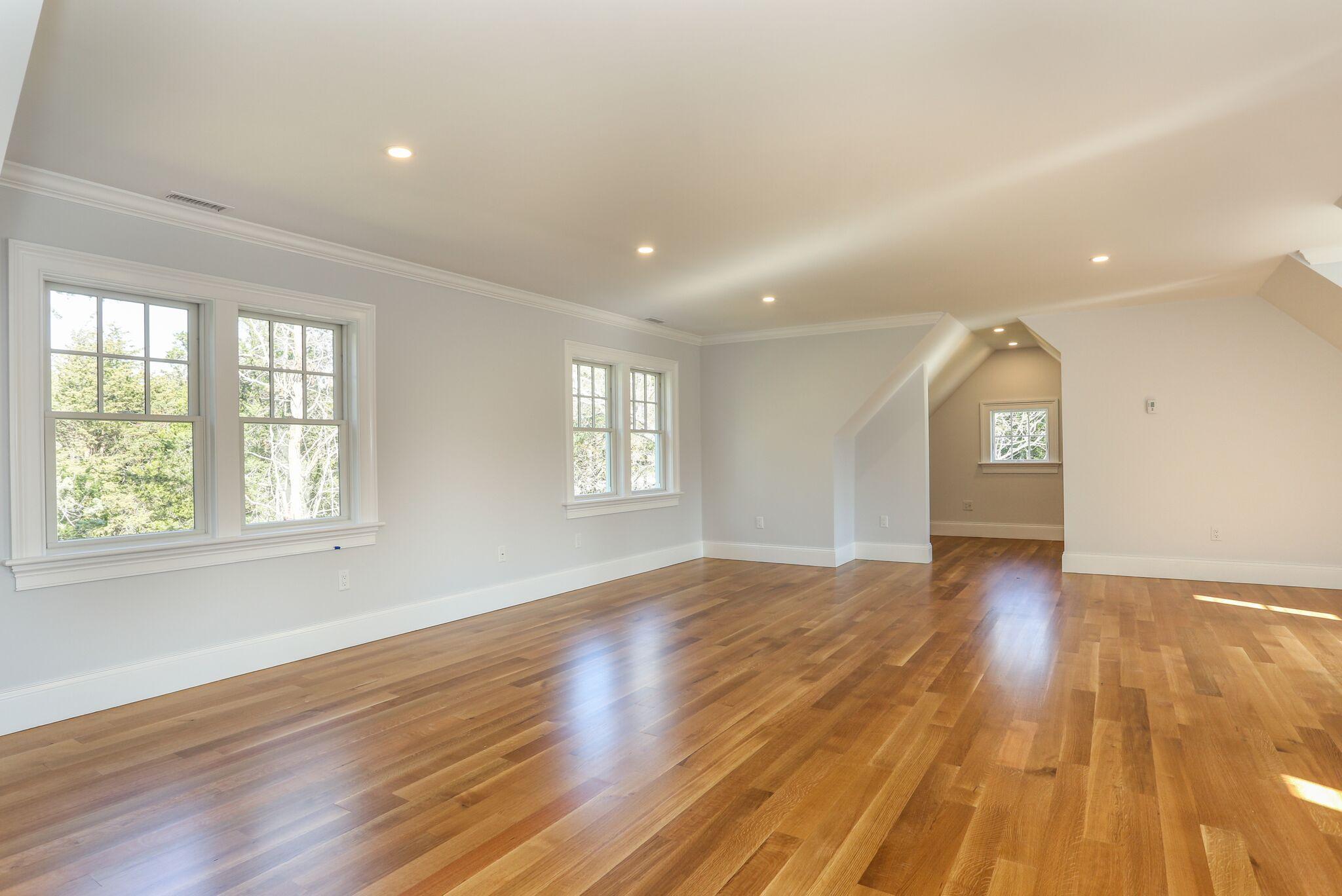 9 Jericho Road Dennis, MA 02638 - Photo 31 of 42 an empty room with wooden floor and windows