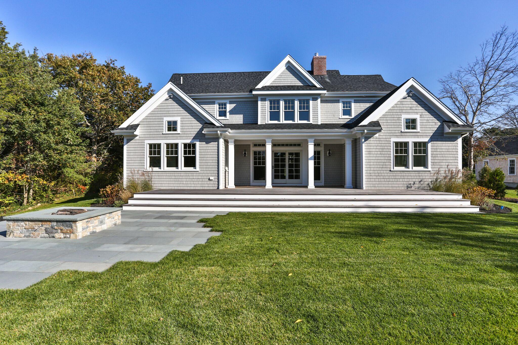 9 Jericho Road Dennis, MA 02638 - Photo 37 of 42 a front view of a house with a garden and yard