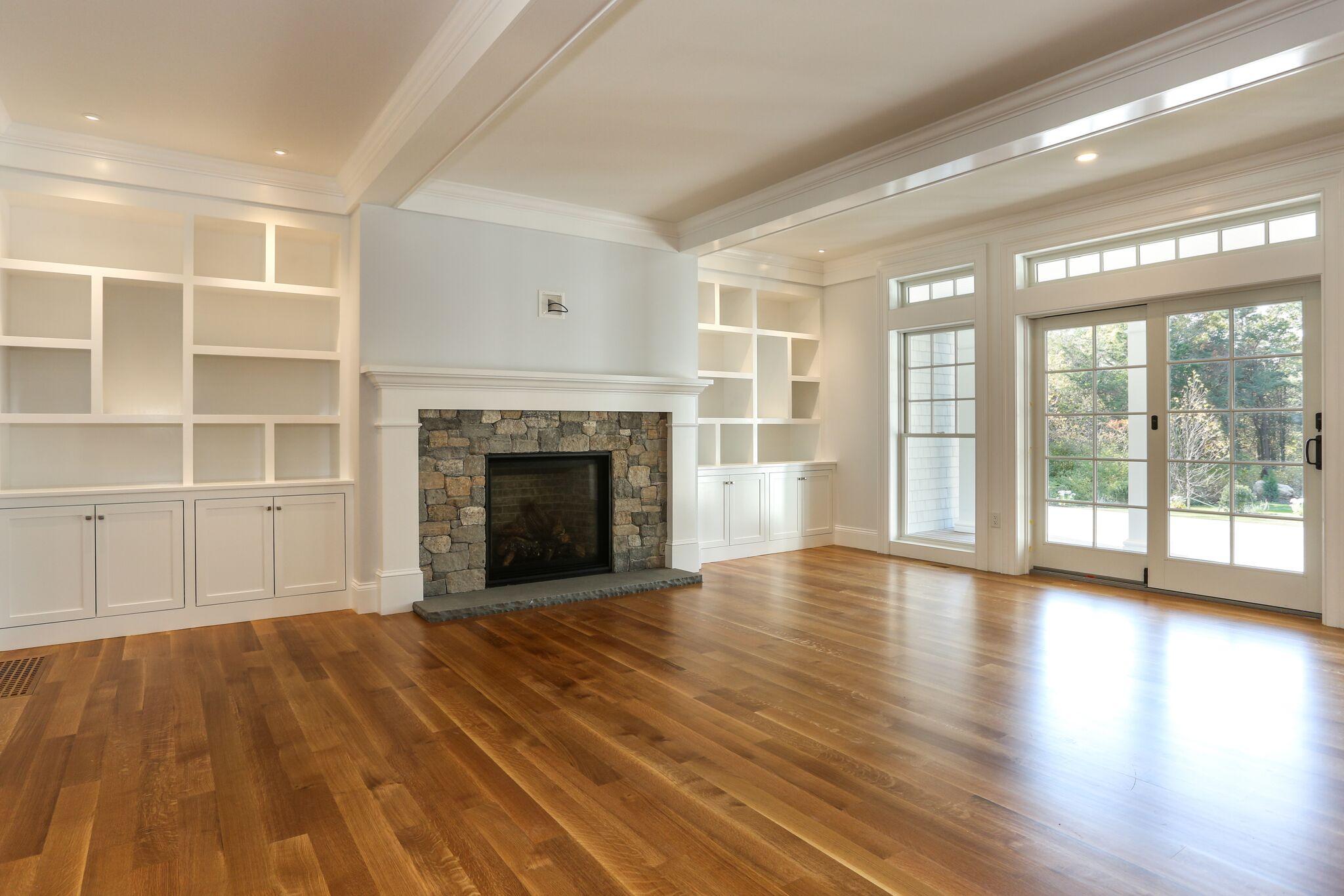 9 Jericho Road Dennis, MA 02638 - Photo 8 of 42 a view of empty room with wooden floor and fireplace