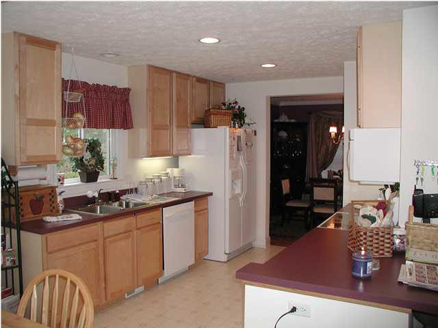 6 Rowell Road Palmyra, VA 22963 - Photo 4 of 5 a kitchen with stainless steel appliances granite countertop a sink refrigerator and cabinets