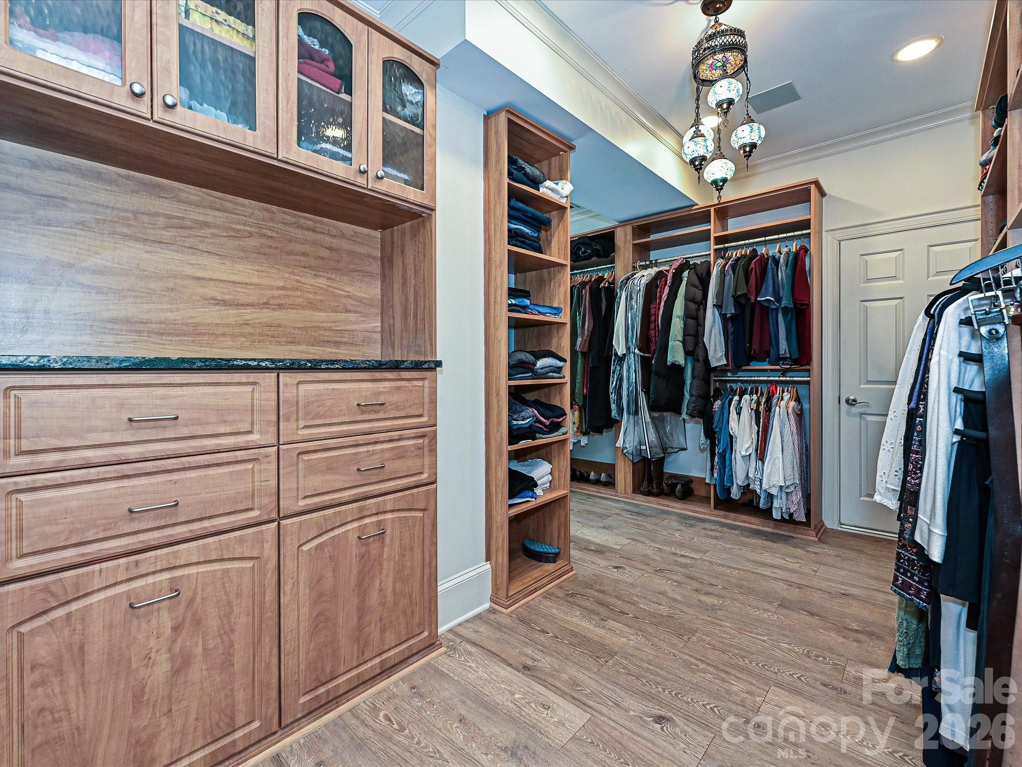 2132 Rolston Drive Charlotte, NC 28207 - Photo 22 of 41 a view of walk in closet with clothes and shoes