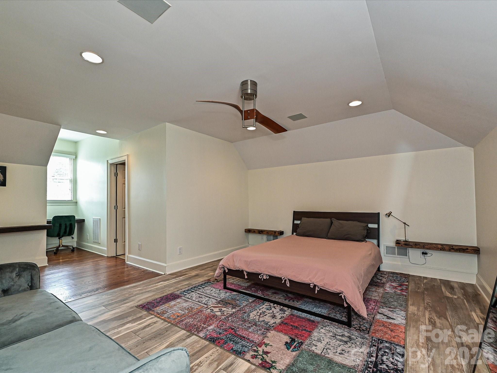 2132 Rolston Drive Charlotte, NC 28207 - Photo 28 of 41 a bedroom with a bed and wooden floor
