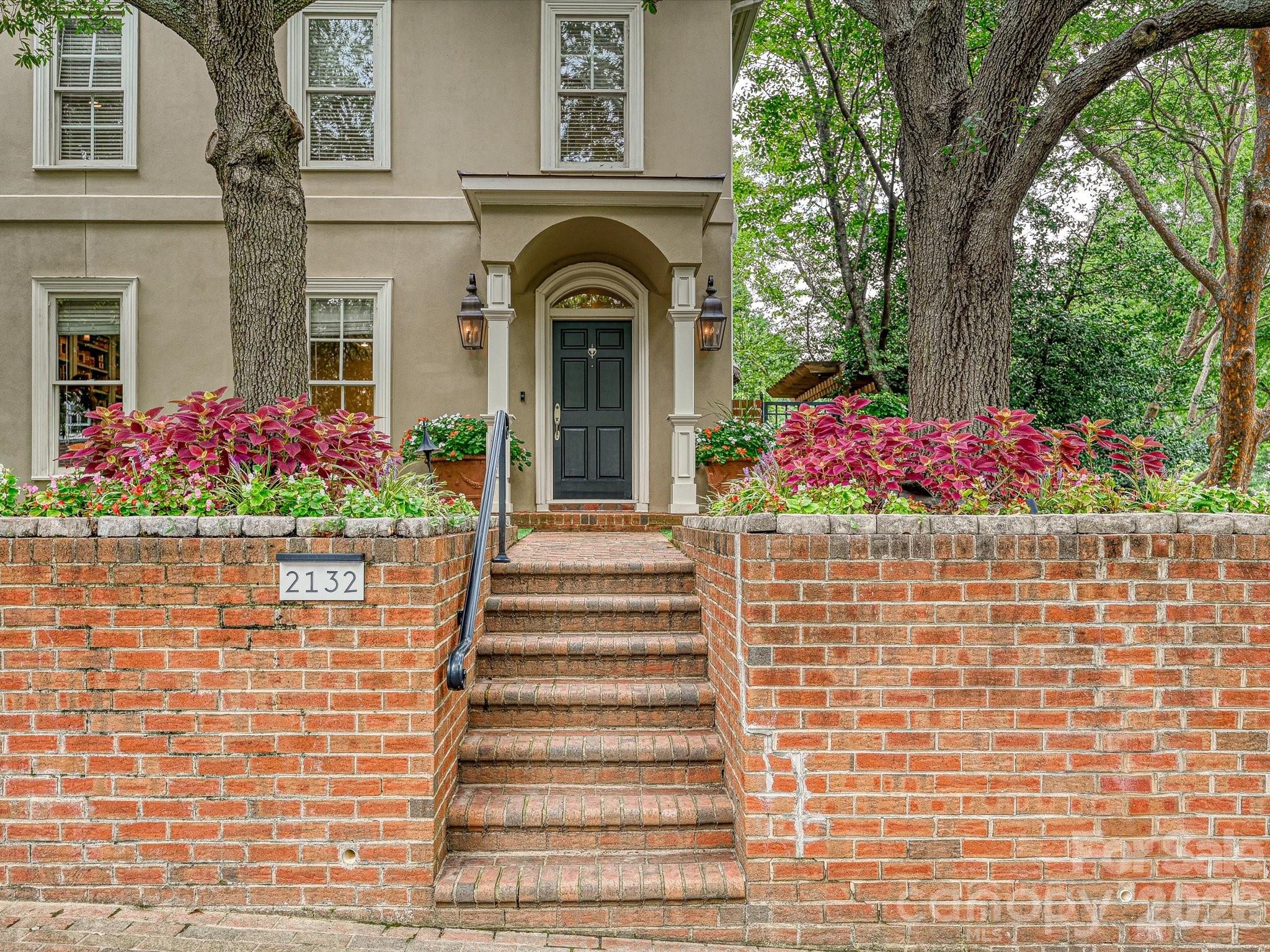 2132 Rolston Drive Charlotte, NC 28207 - Photo 40 of 41 a front view of a house with a garden