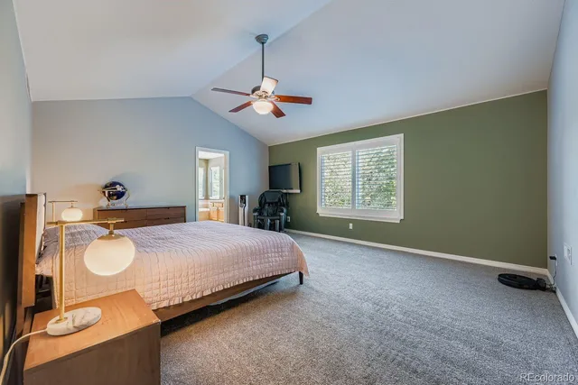 a bedroom with a bed dresser and a window